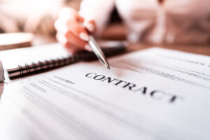 woman-pointing-at-business-contract-with-silver-pen-picjumbo-com
